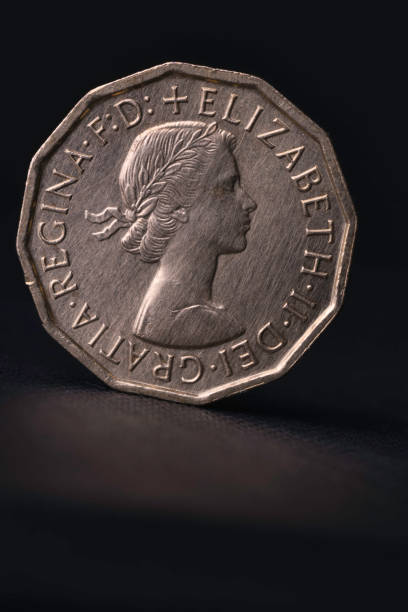 Haverfordwest, Wales - November 23, 2022: Studio shot of an obsolete British three pence coin - known as a 'thrupenny bit'. These were phased out following the UK's decimalisation in 1971. In decimal money, they were worth about 1.2. The coin was first used in 1551 (though as a circular silver coin) with the twelve-sided version introduced in the late 1930s and phased out in 1971.