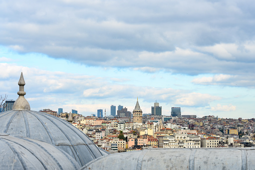 Stunning view of the Istanbul skyline with the Galata Tower in the distance during a cloudy day. Istanbul, Turkey.