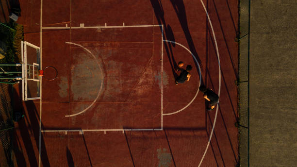 istock Friends playing basketball 1444144581