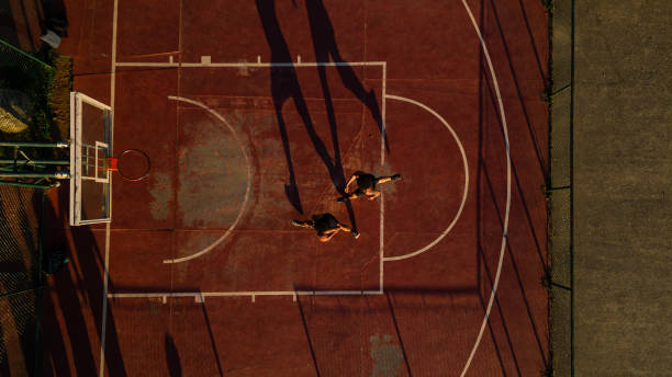 istock Friends playing basketball 1444144595