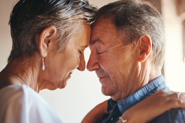 istock Love, support and elderly couple hug, commitment and understanding in their home together. Wellness, intimate and romantic seniors enjoy soulmate connection while bonding with affection and romance 1444144925