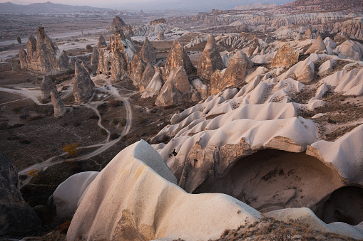 Stunning view of some rock formations in the Red & Rose Valley in Cappadocia during a beautiful sunset. Goreme, central Antolia, Turkey.