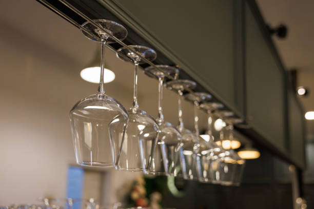 istock wine glasses are hanging on stainless steel rack at kitchen bar. 1444145362