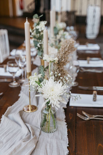 istock Romantic and rustic table decoration in white and gold 1444145370