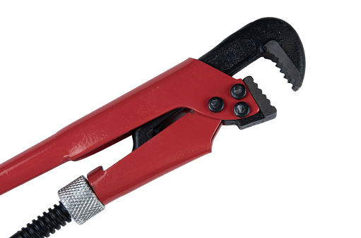 Close up of iron red and black wrench isolated on white background with clipping path