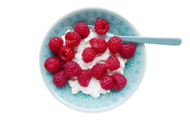 Fresh berries with cottage cheese in small bowl stock photo
