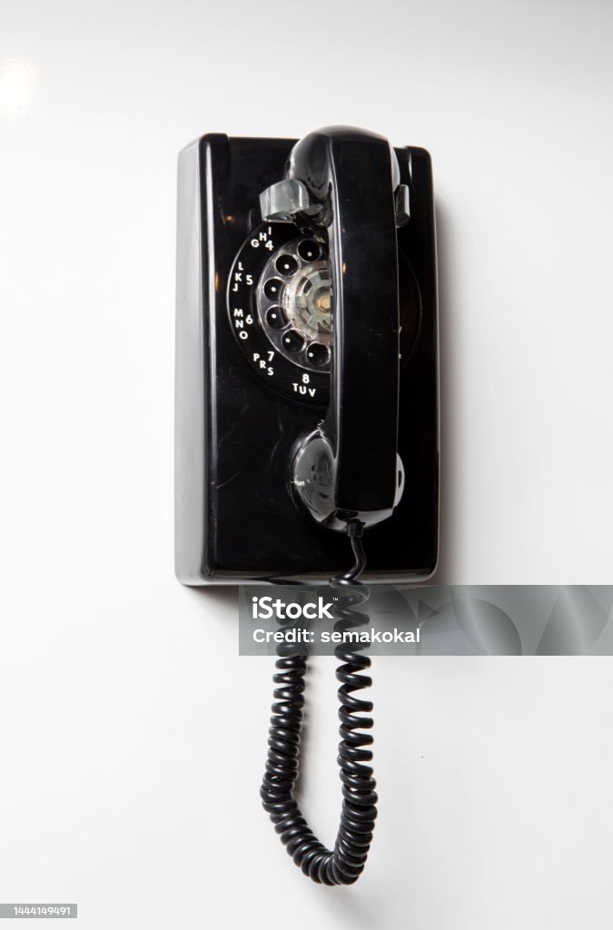 Old telephone isolated white background Rotary Phone Stock Photo