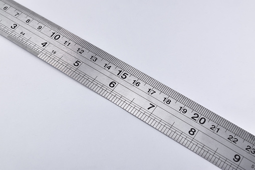 Iron Ruler isolated white background. Unit is Centimeters and inch.