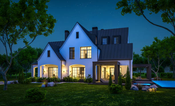 istock 3d rendering of white and black modern Tudor house in night 1444156838