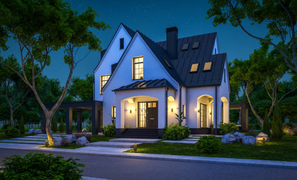 istock 3d rendering of white and black modern Tudor house in night 1444156844