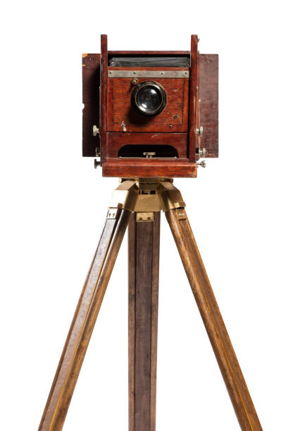 istock Retro film photo camera isolated on white background. 1444156995