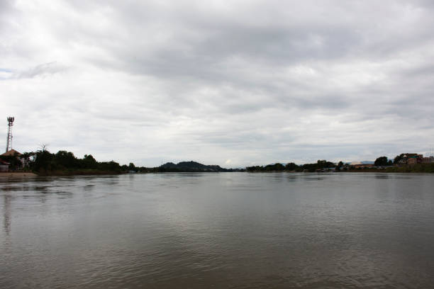 View Landscape Pak Nam Pho confluent estuary Chao Phraya and Ping river with rapid current water fast at landmarks Pa San or Pasan wooden bridge and cityscape of Nakhonsawan in Nakhon Sawan, Thailand