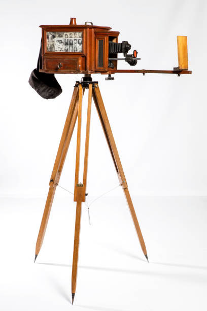 istock Retro film photo camera isolated on white background. 1444159028