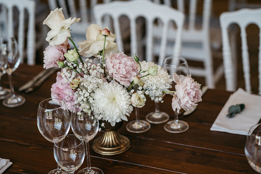 Table decoration with flower decoration on dark wooden table