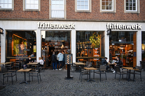 Münster, Germany, October 18. 2021: View of a Frittenwerk restaurant in the Salzstraße in Münster, Germany