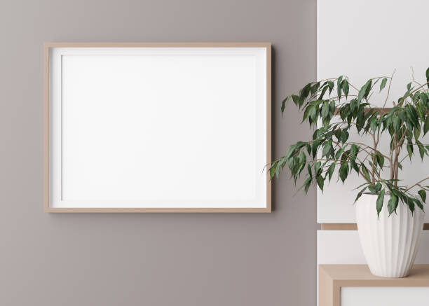 istock Blank horizontal picture frame hanging on beige wall. Template, mock up for your artwork, picture or poster. Empty, copy space. Close up view. Simple, minimalist mockup. 3D rendering. 1444170414
