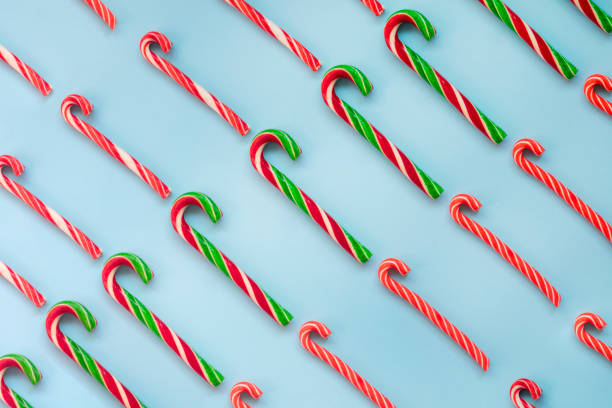 istock Christmas Candy Canes on Blue Background 1444170633