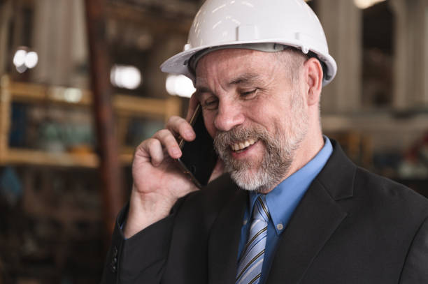 istock Caucasian senior engineer manager working with smartphone at factory 1444171170