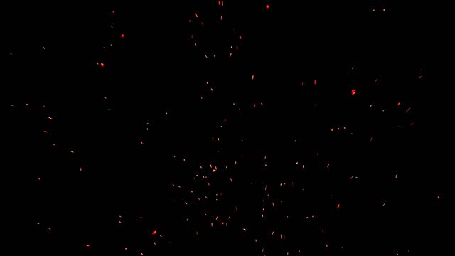 Bonfire burning particles filmed on black ideal to use as an overlay to add hot embers to any footage