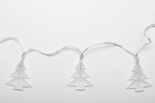istock Christmas tree shape Christmas lights on the white background 1444171965