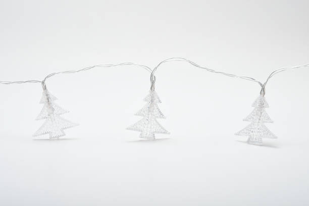 istock Christmas tree shape Christmas lights on the white background 1444172139