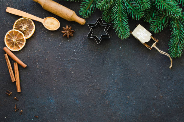 istock Christmas culinary background for menu or recipe. Spices for baking and fir branches on concrete. 1444172914