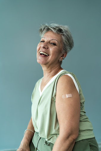 Portrait of a senior woman with a bandage on the arm