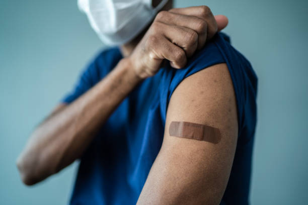 istock Man's arm with a bandage on a studio shot 1444178473
