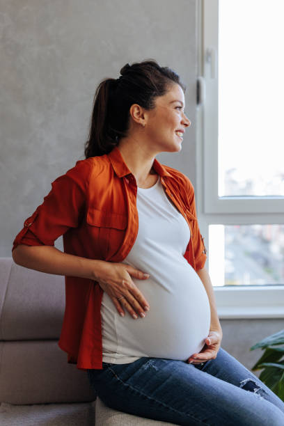 istock Pregnant woman daydreaming. 1444178508