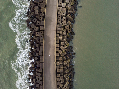 aerial view of a jetty at the entrance of the harbour of Scheveningen; The Hague, Netherlands