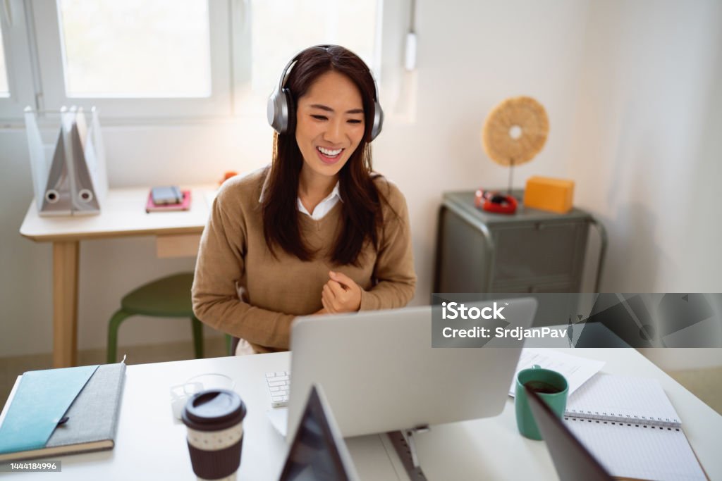 Young Asian ethnicity businesswoman having a video conference at her office Young Asian ethnicity businesswoman having a video conference at her office. Web Conference Stock Photo