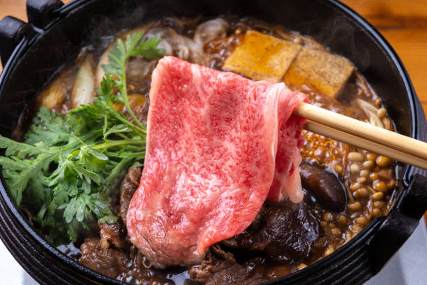 Japanese black beef sukiyaki Japanese black beef sukiyaki crown daisy stock pictures, royalty-free photos & images