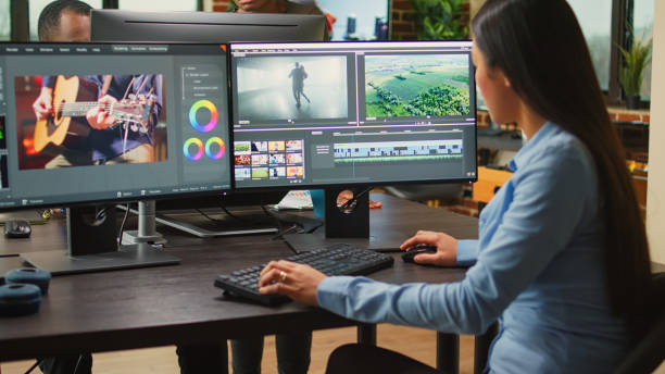 istock Asian film maker working on movie footage quality with editing software 1444187244