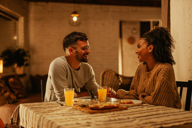 istock Loving couple dinning at home. 1444188518