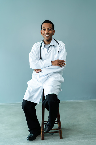 Portrait of a doctor on a gray background