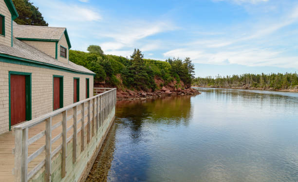 Basin Head, PEI river 2 Basin Head beach, Singing Sands docks and building riverside view cavendish beach at prince edward island national park canada stock pictures, royalty-free photos & images