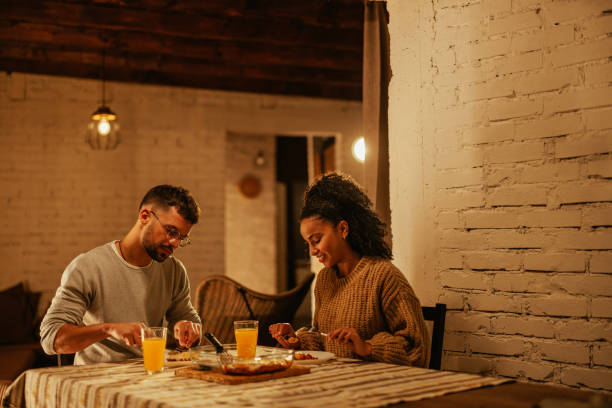 istock Couple having quiet dinner at home. 1444189147