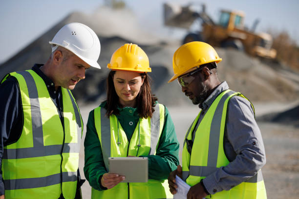 Engineers discussing at building site stock photo
