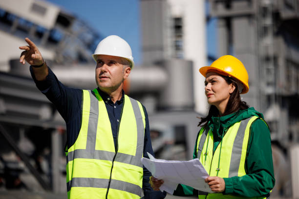 istock Male and female industrial engineers discussing 1444190538
