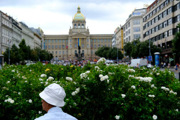 An elder man relax in Wenceslas Square  in Prague, Czech Republic on July 27, 2022.
