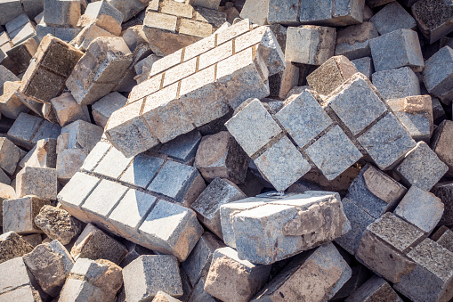 Close up of a pile of rubble from a concrete wall after the demolition of an industrial building.