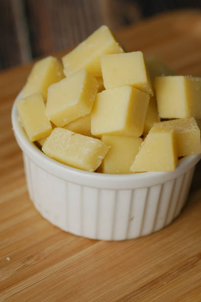 istock close up of cube shape fresh cheese on in a bowl 1444196197