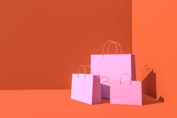 istock pink shopping bag on orange background 1444202260