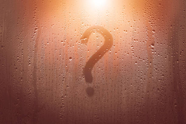 istock a question mark on a fogged window, a question mark drawn on a window with a finger 1444204035