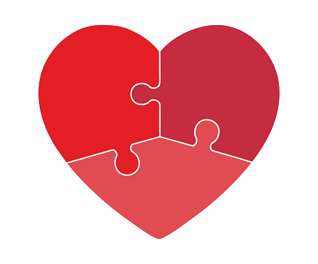 Symbolic heart with three pussle pieces, jigsaw puzzle properly cutted to separate if you like.