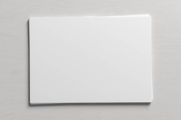 istock Stack of paper mockup on the white wooden table. 1444204947