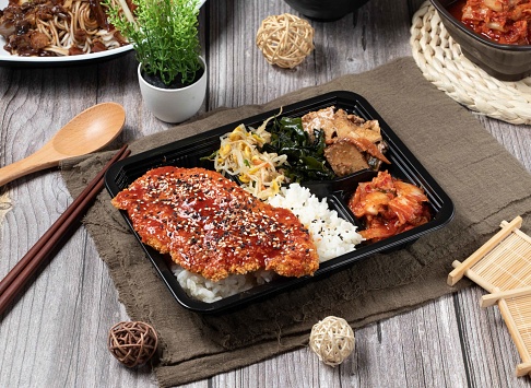 Korean Chicken Chop rice Bento served dish isolated on table top view of asian food