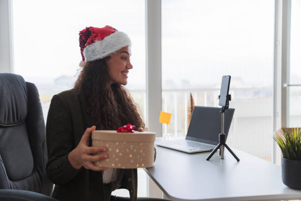 istock Influencer making a video regarding Christmas present shopping 1444207742