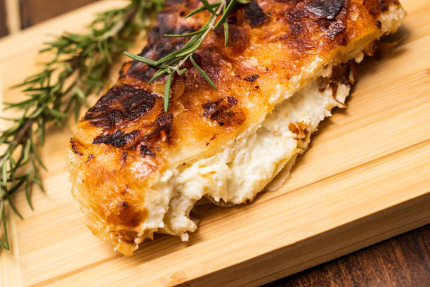 istock Homemade cheese pie, one piece on cutting board 1444208652