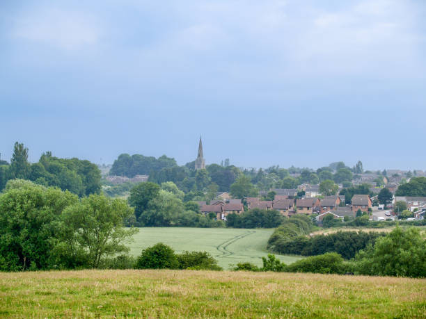 istock Beyond fields an English village 1444210797